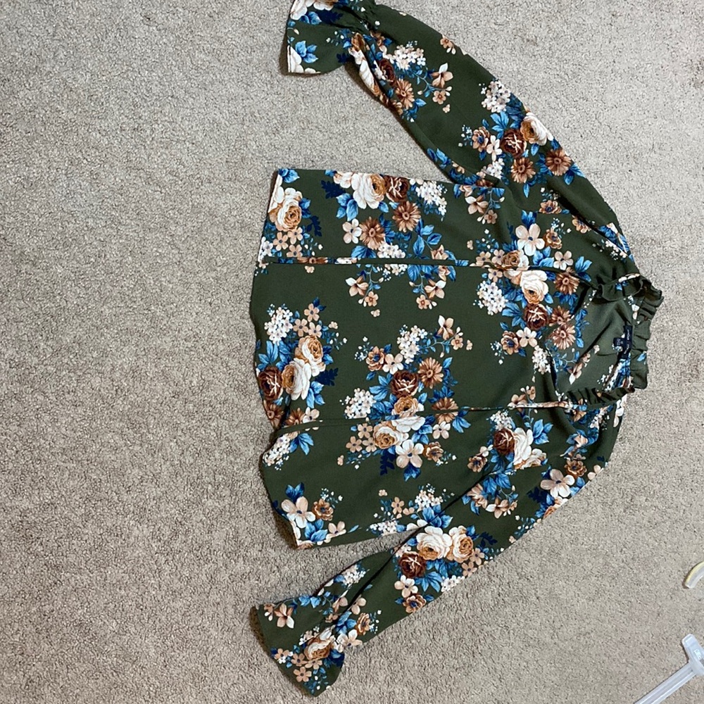 Floral polyester shirt, had laces to tie and style.